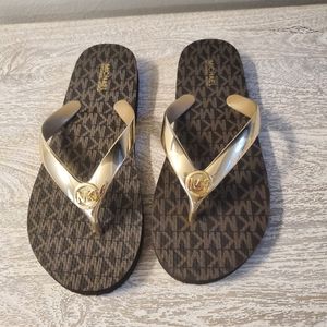 Michael Kors metallic gold flip flops